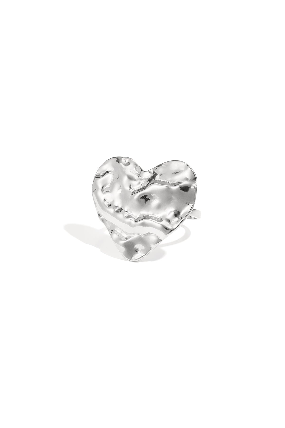 Close-up of a textured silver heart-shaped statement ring on white background
