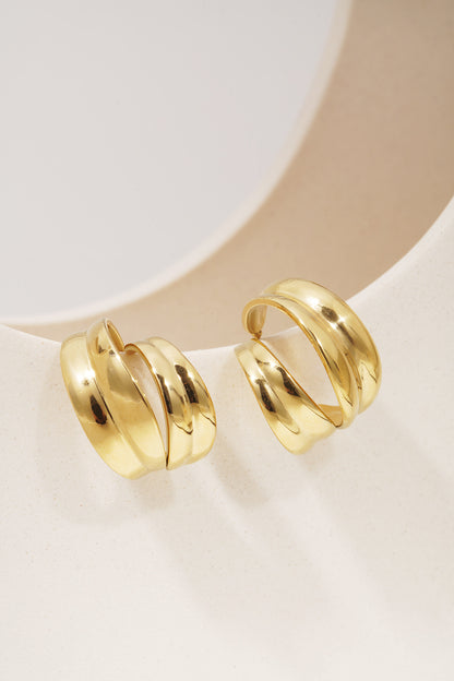Sculpted Aura Loops: Pair of chunky, gold-plated open hoop earrings with a polished, sculptural, double-layered design.