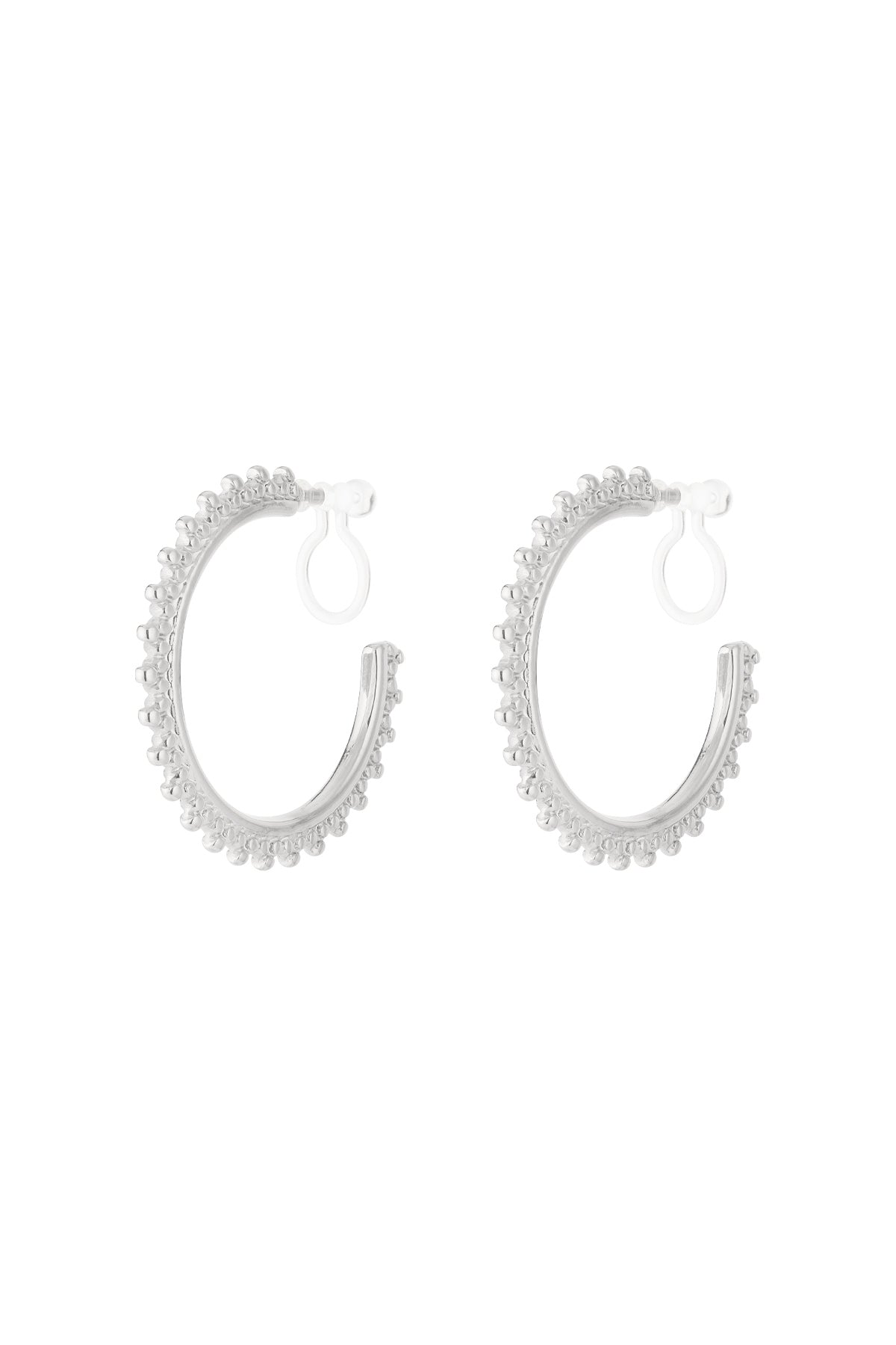 Pair of silver beaded edge clip-on hoop earrings on a white background