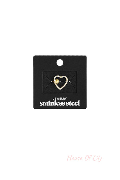 Main Character Heart stainless steel ring featuring a pavé-style crystal heart with a central gold ball accent.