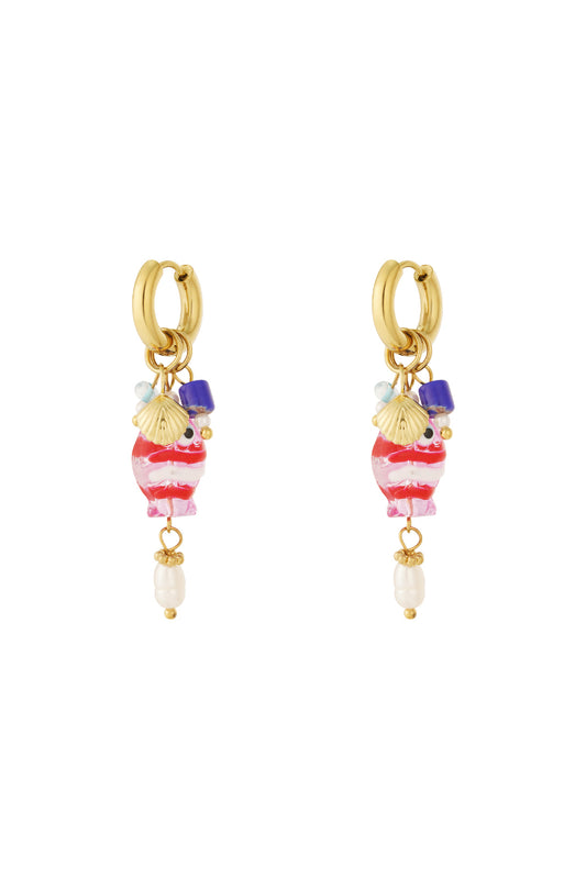 Pair of gold-tone hoop earrings featuring dangling pink and white striped resin fish charms with blue beads and faux pearl drops on a white background