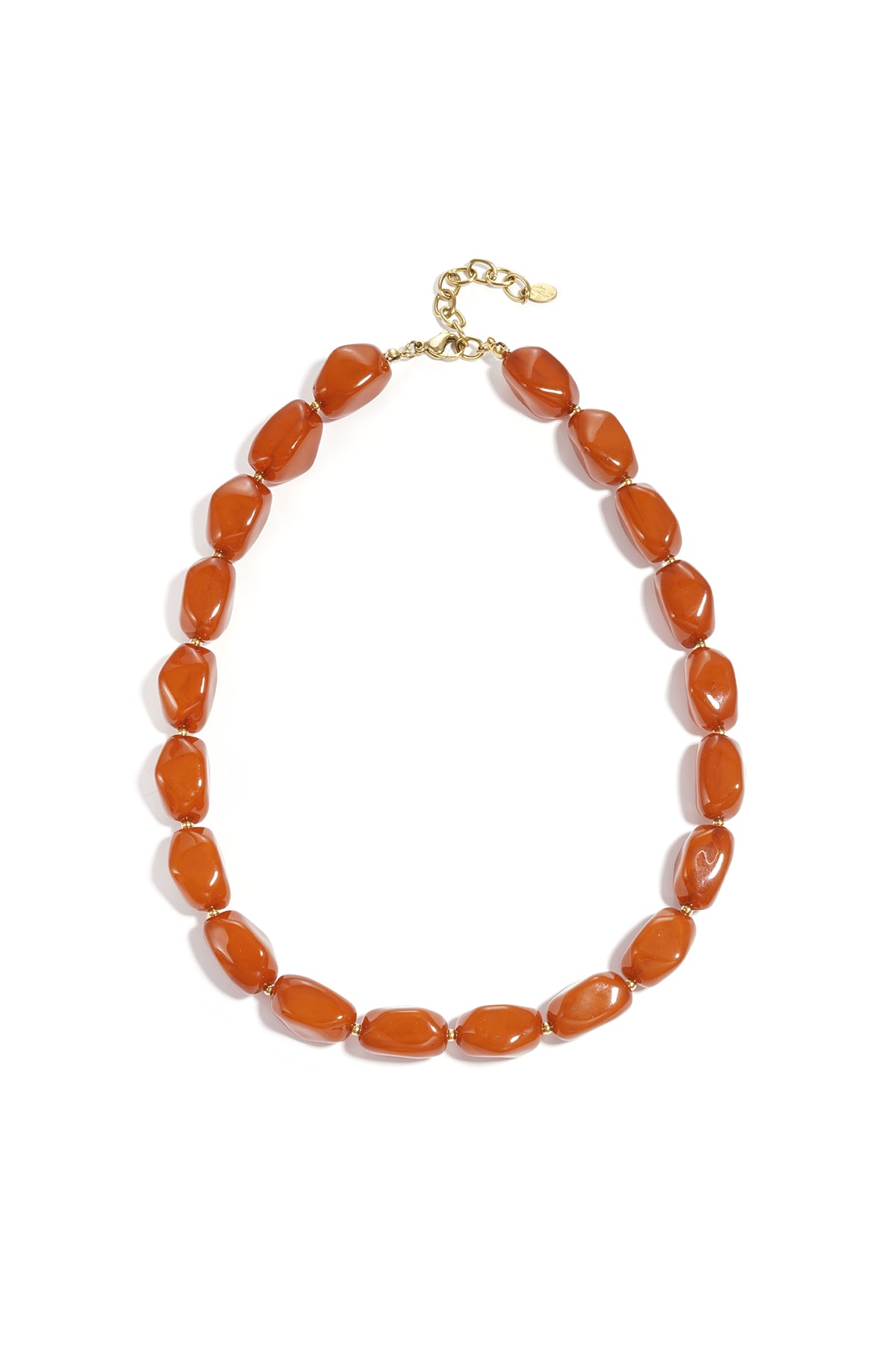 Amber-colored chunky acrylic beaded necklace with gold chain extender and clasp on white background