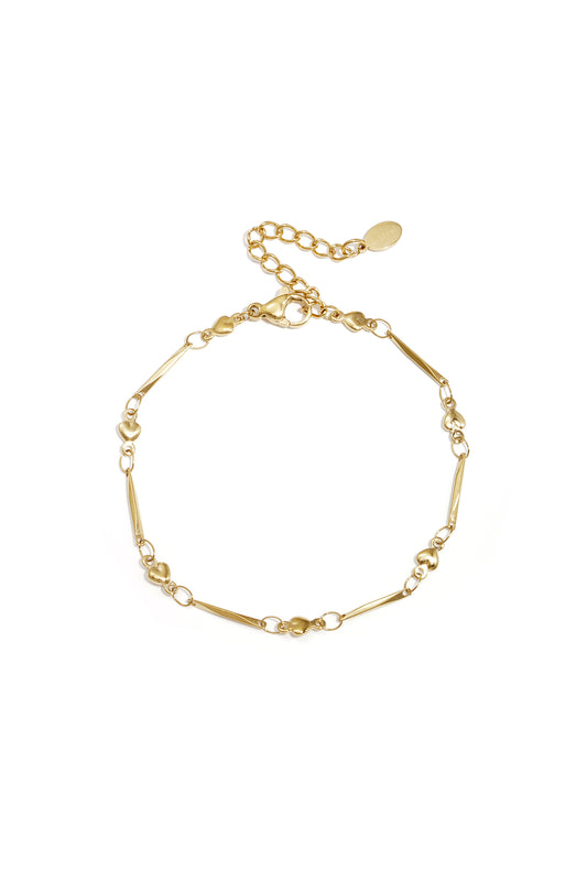 Close-up image of a delicate gold heart link bracelet with lobster clasp and adjustable chain on white background.