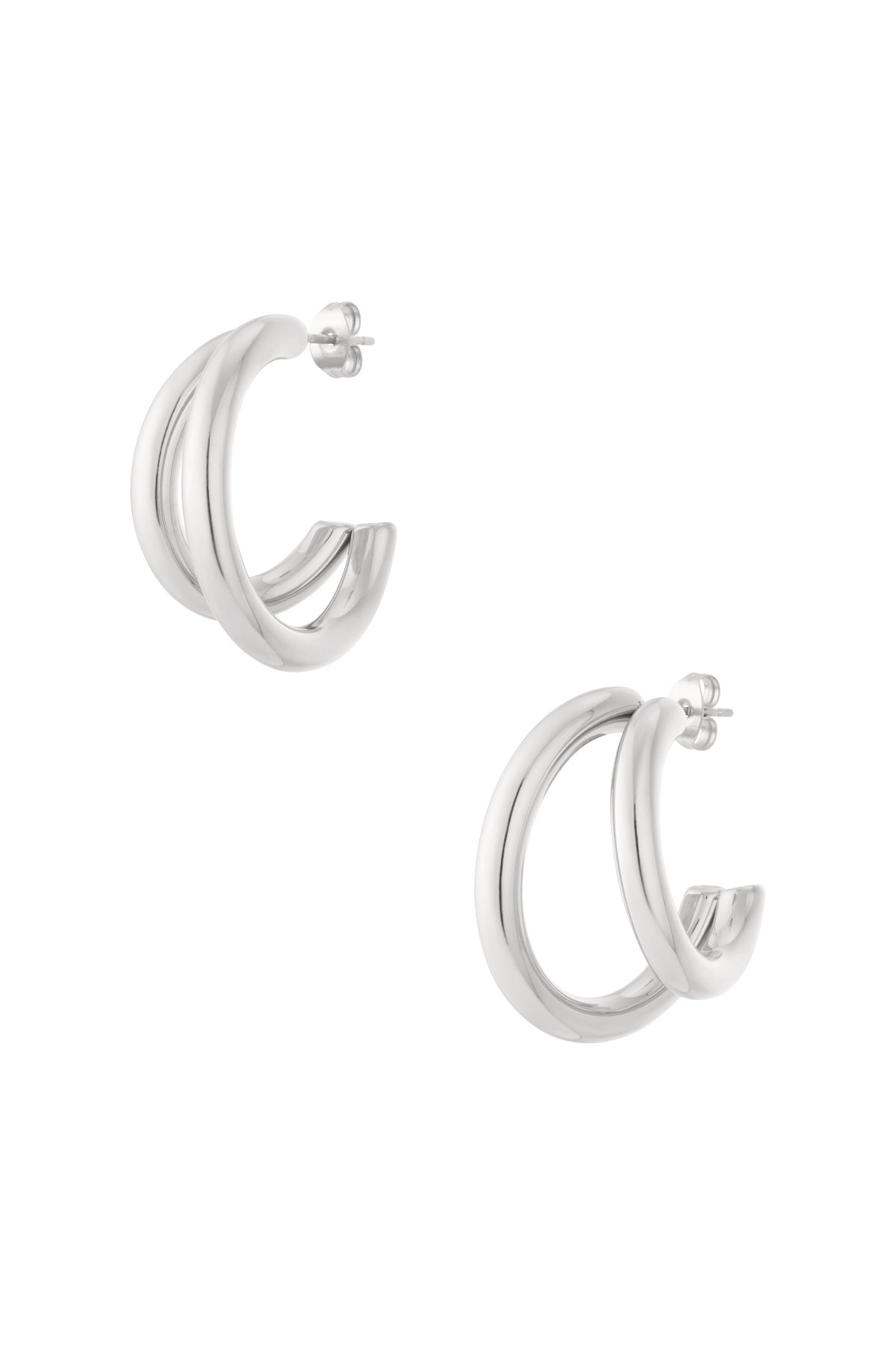 Silver chunky double hoop earrings with smooth polished finish isolated on white background