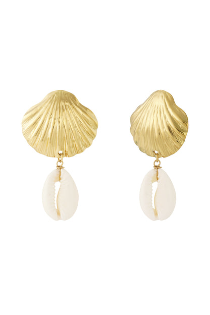 Pair of gold seashell-shaped drop earrings with dangling white cowrie shells displayed on a white background