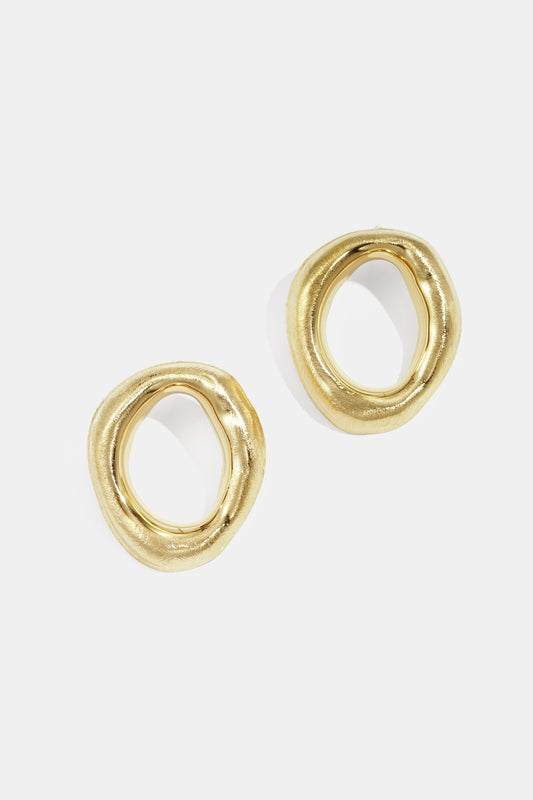 Pair of organic shape gold-tone hoop earrings with irregular rounded design on white background