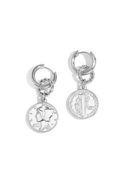 Pair of silver vintage coin hoop earrings with twisted ring detail isolated on white background