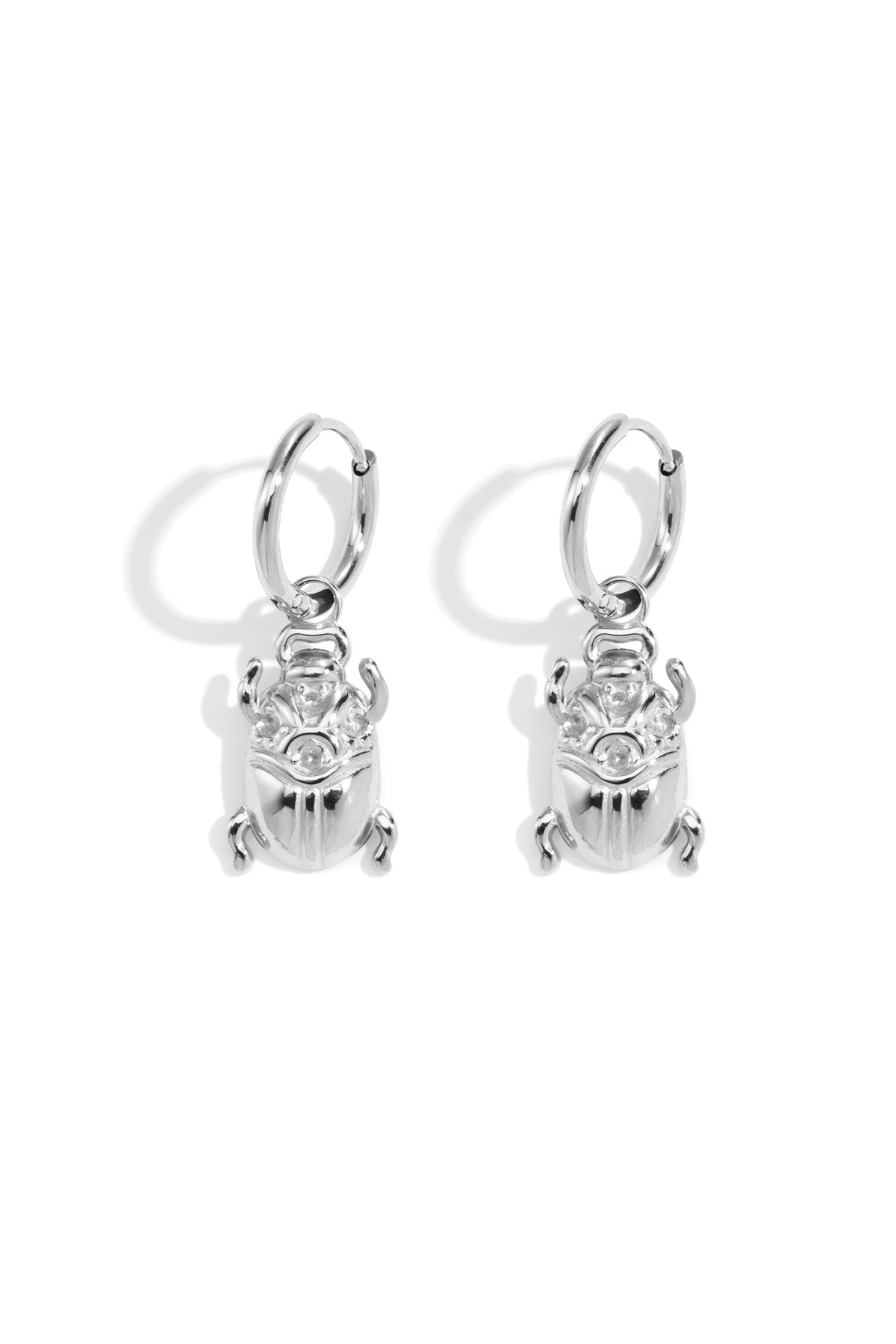 Pair of polished silver bug-shaped drop earrings with hoop fastenings displayed on white background