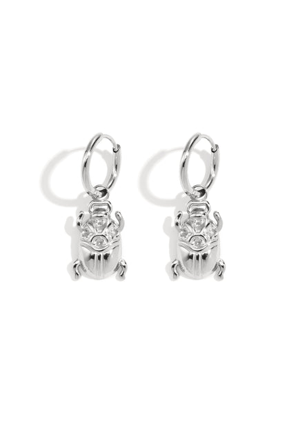 Pair of polished silver bug-shaped drop earrings with hoop fastenings displayed on white background