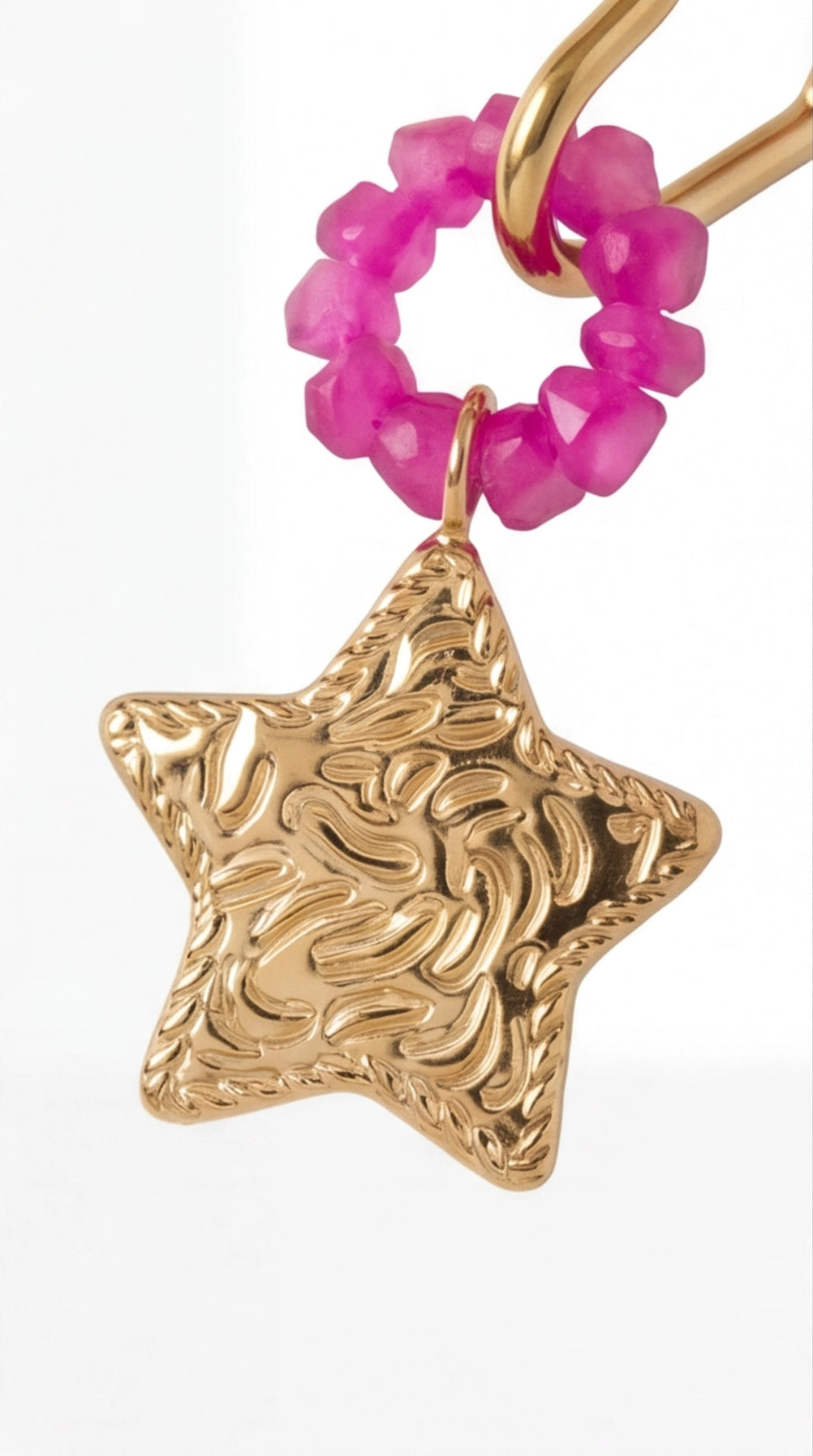 Shooting Star Drops earring featuring a textured gold star pendant hanging from a circle of bright pink faceted beads.