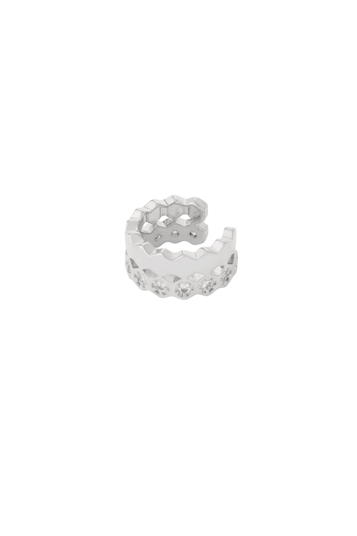 Close-up of a shiny silver geometric ear cuff with zigzag design and embedded crystals
