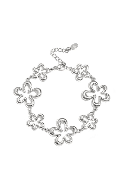 Silver-tone charm bracelet with multiple open flower charms linked by chain against white background