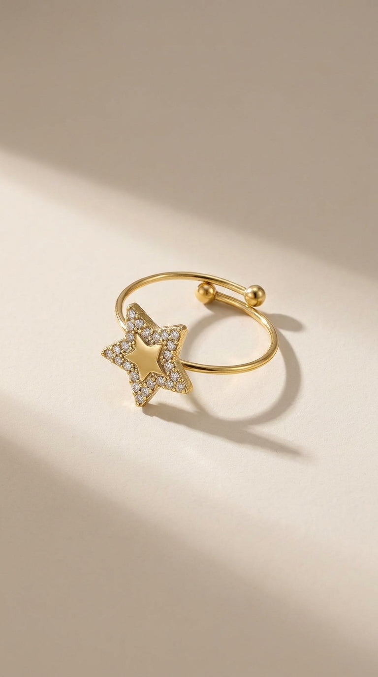 Gold Celestial Star Statement Ring with pavé-set crystals on a star motif and ball-accented open band.
