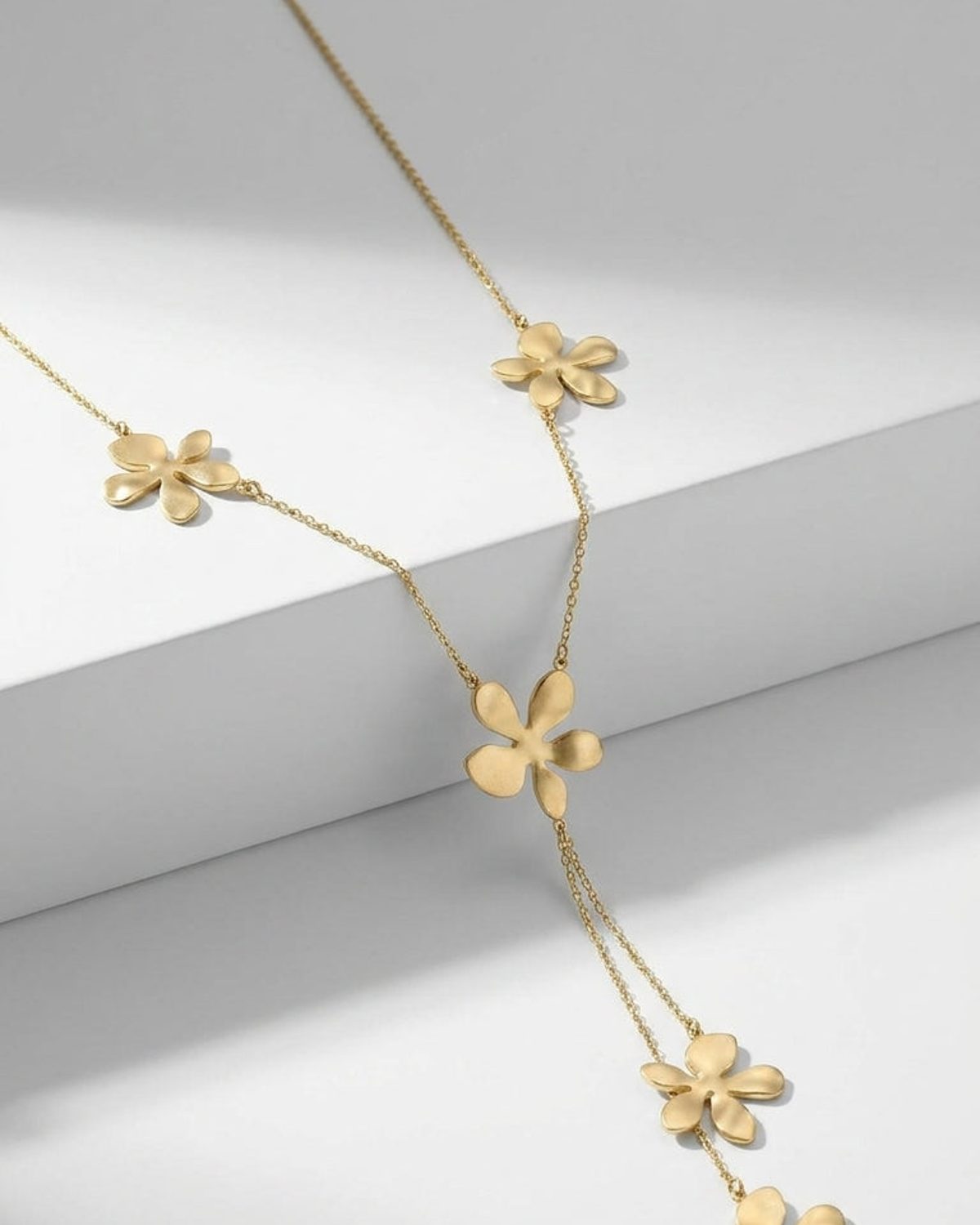 Gold Daisy Flower Party Chain necklace with matte daisy charms along a delicate chain and hanging drop.