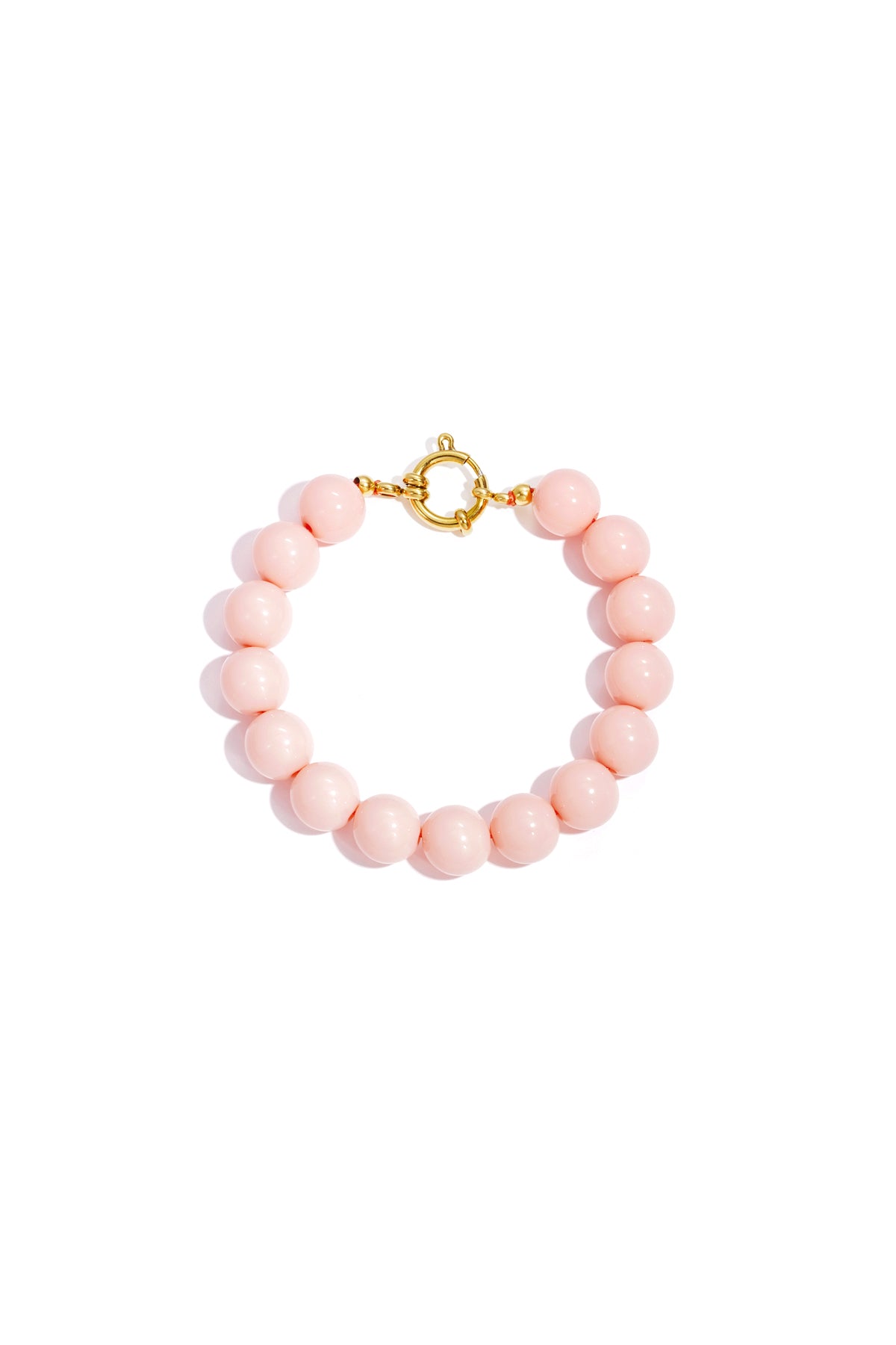 Vibrant pink resin bead bracelet with a round gold spring-ring clasp on a white background.