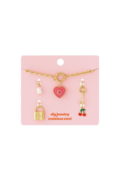 Whimsy Era stainless steel gold-tone chain necklace set with pearl, heart, key, padlock, and cherry charms.