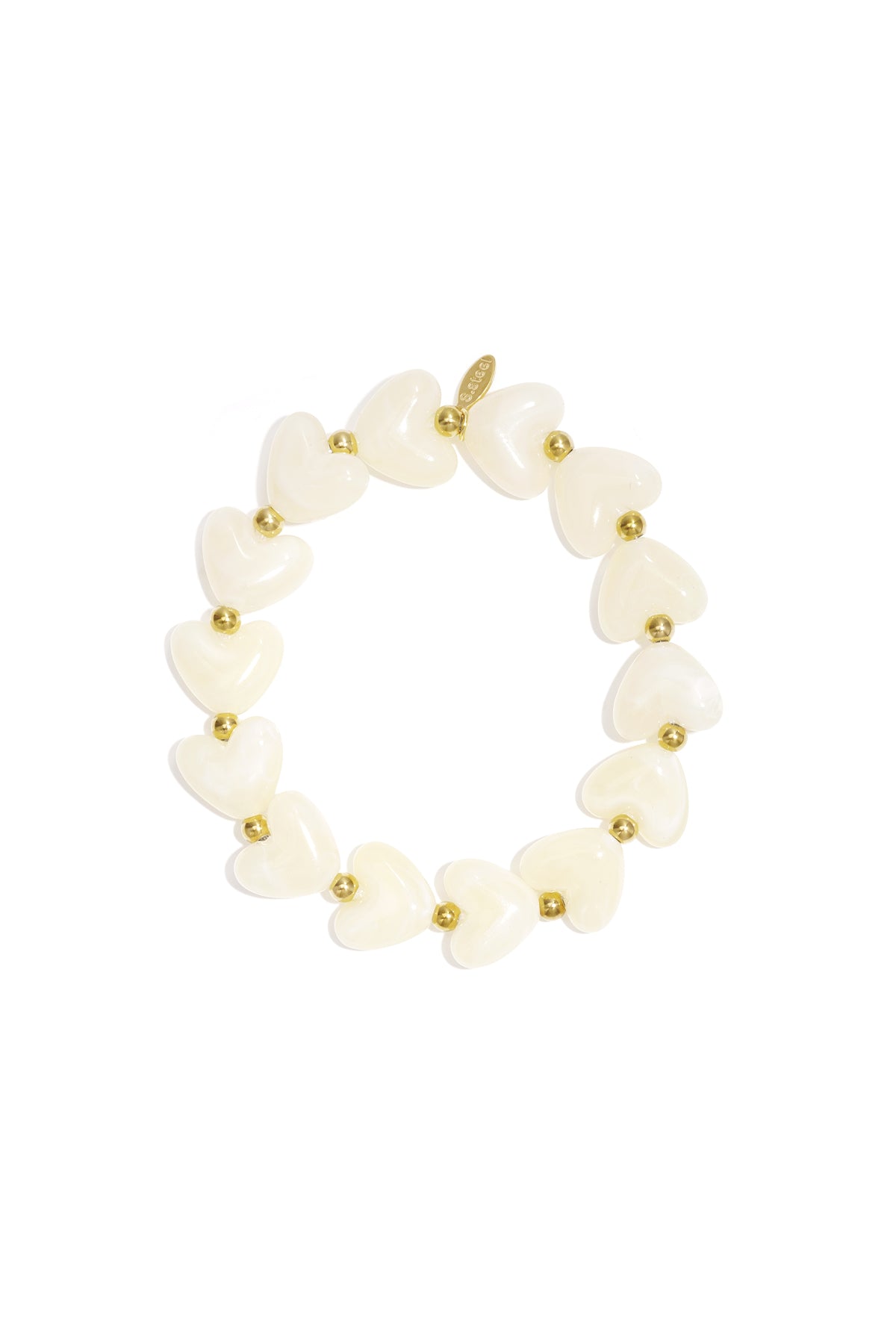Stretch bracelet featuring alternating cream-colored heart-shaped beads and small gold-tone metal spacers.