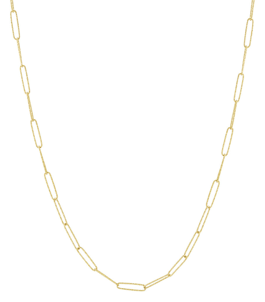 Gold elongated link chain necklace laid flat on white background