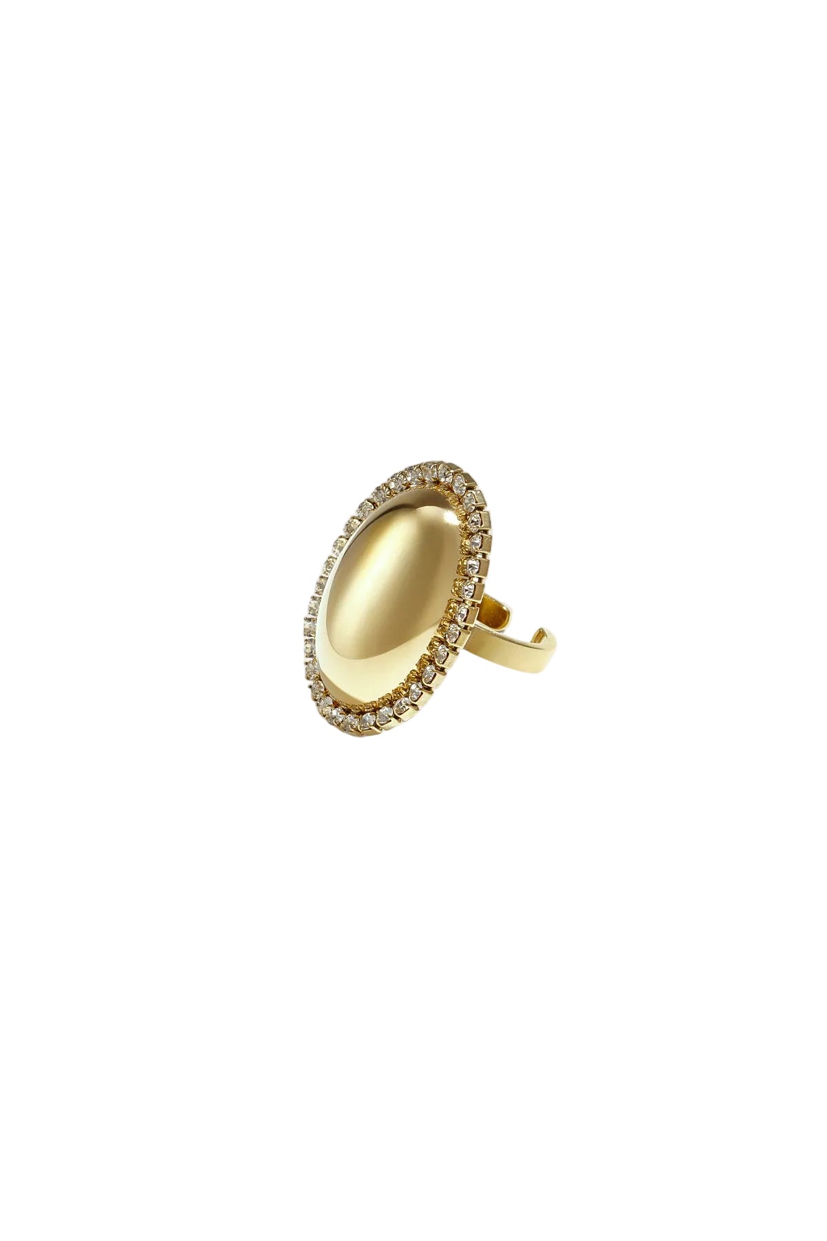 Close-up of a golden oval statement ring with rhinestone border on a white background.