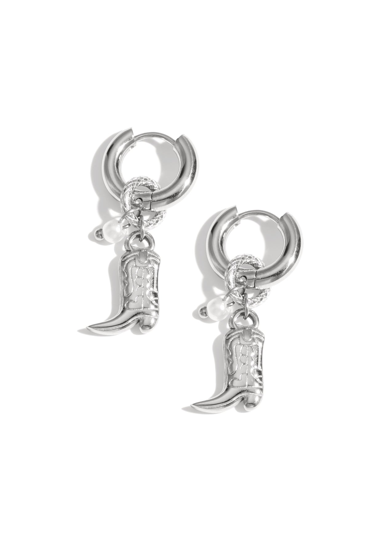 Silver hoop earrings with cowboy boot charms and pearl accents displayed on white background