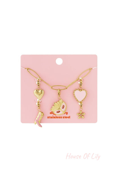 Golden It-Girl stainless steel chain necklace featuring heart, cowboy boot, masquerade mask, and flower charms.