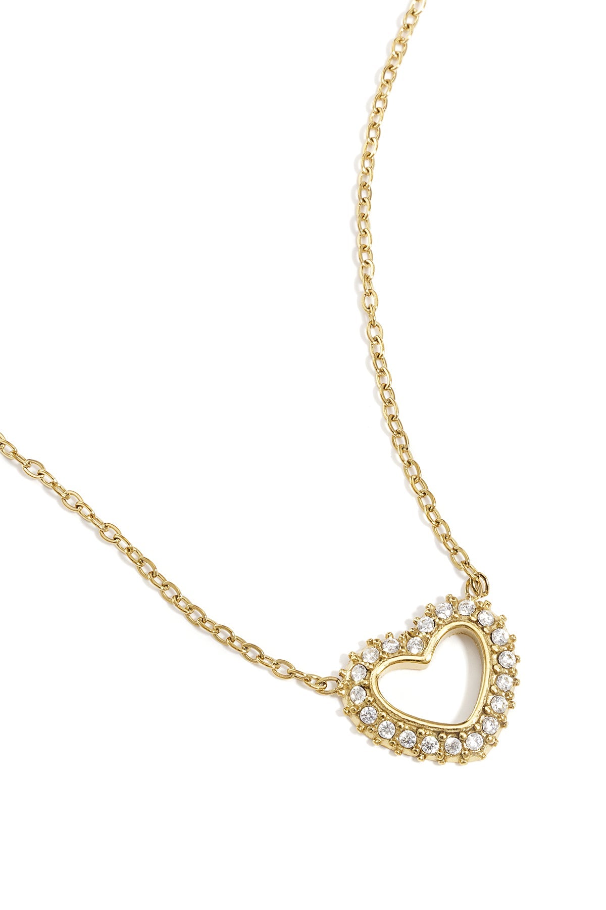 Close-up detail of gold heart pendant necklace highlighting the sparkling rhinestones and chain links