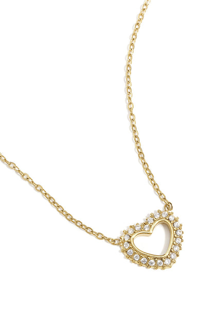 Close-up detail of gold heart pendant necklace highlighting the sparkling rhinestones and chain links
