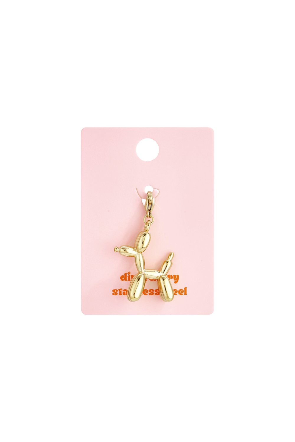 Gold-toned stainless steel balloon dog charm featuring a playful, minimalist design on a light pink display card.