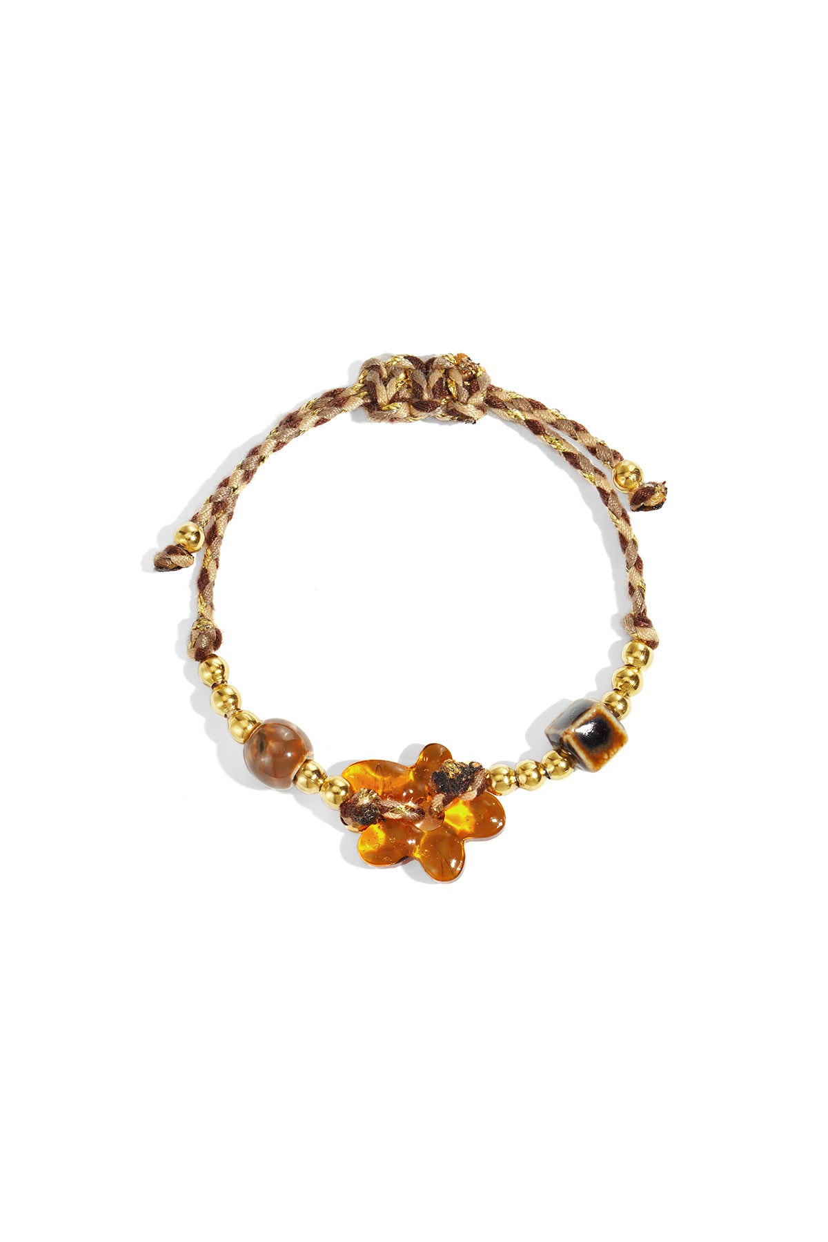 Brown and gold beaded bracelet with an amber glass flower centerpiece, shown on white background