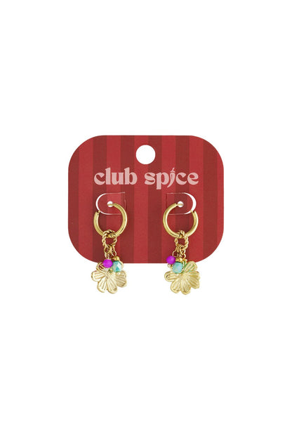 Gold hoop earrings with etched flower charms, accented with small pink and turquoise beads, on a striped display card.