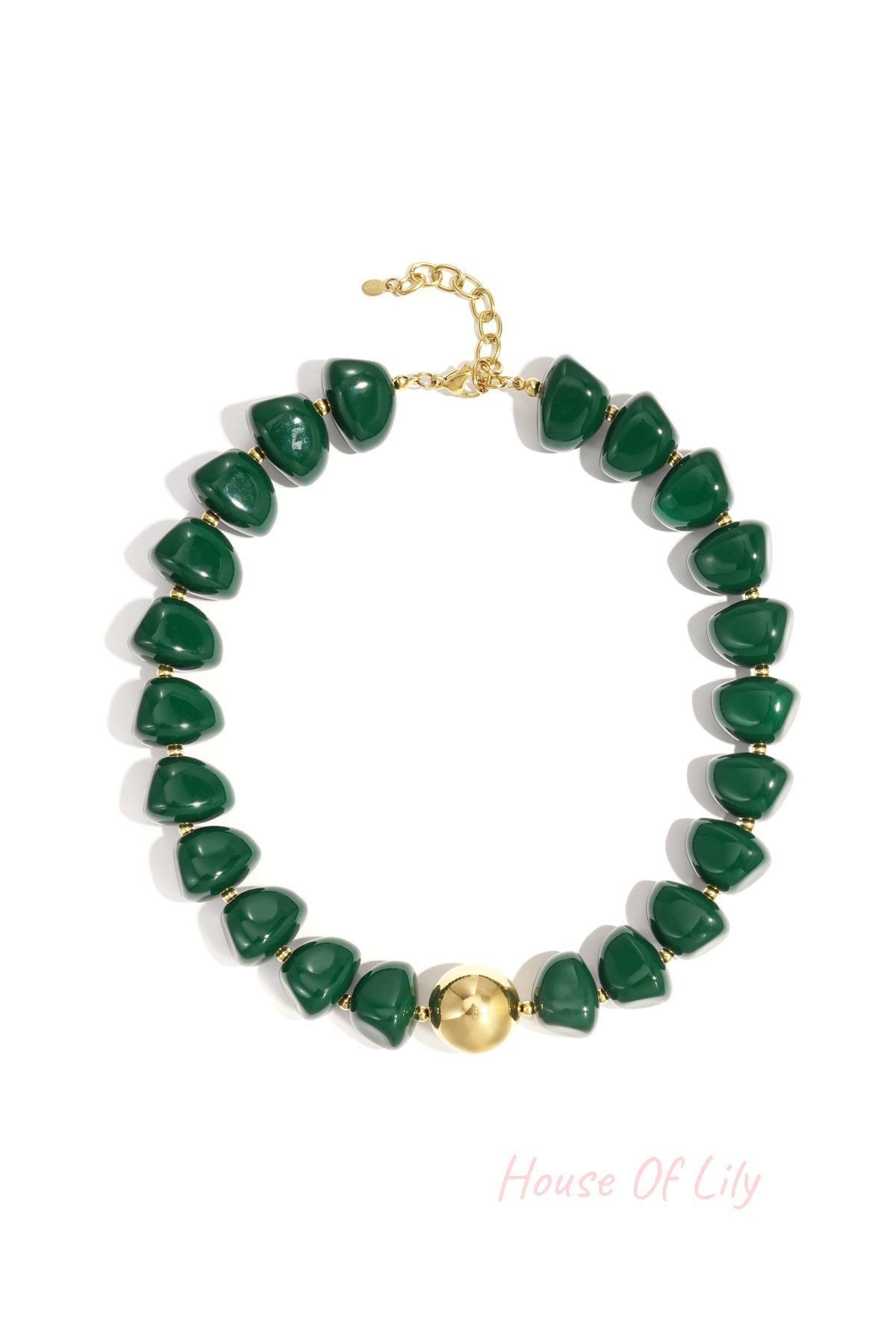 Close-up of a chunky green beaded necklace with gold clasp and centerpiece bead on white background