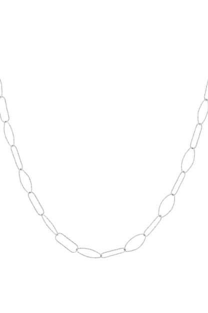 Close-up of silver textured paperclip chain necklace with elongated oval links on white background