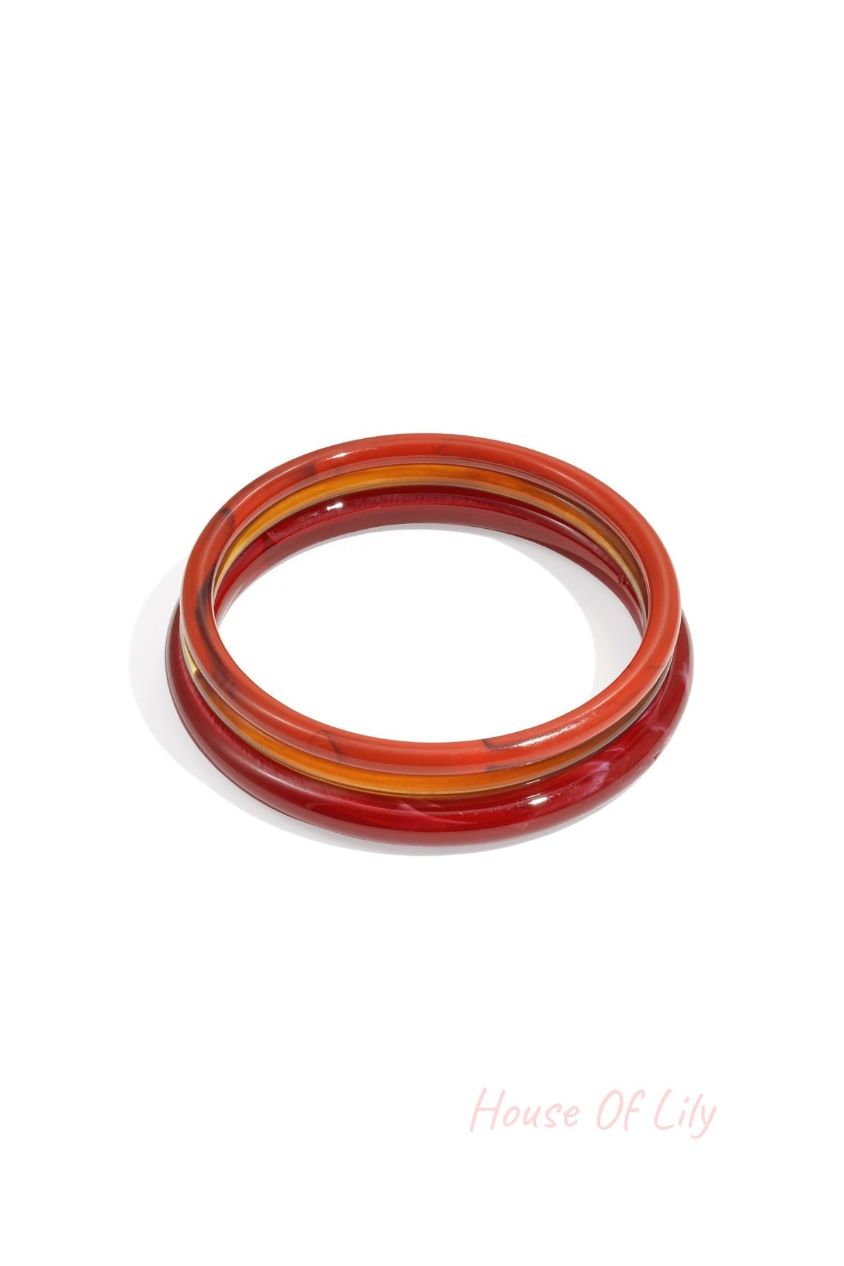 Resin bangles in warm cream and amber hues with marbling and translucent effects