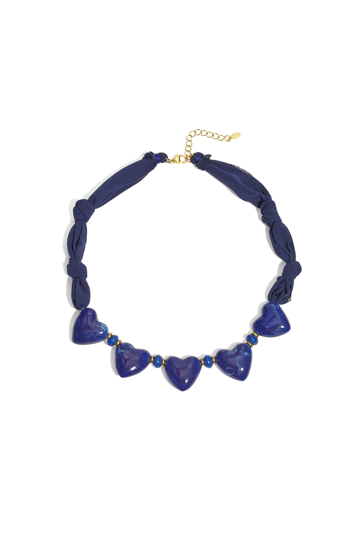 Close-up image of a navy fabric necklace with five glossy blue heart-shaped beads and gold accents