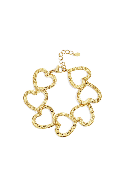 Gold-tone hammered heart link bracelet laid flat with lobster clasp and adjustable chain