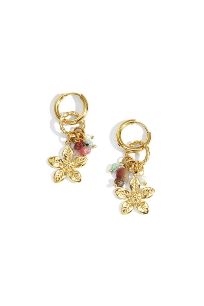 Pair of gold floral drop earrings with twisted hoop and colorful bead charms on white background