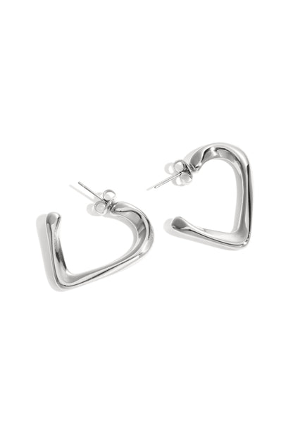 Pair of silver heart-shaped hoop earrings with smooth polished finish on white background