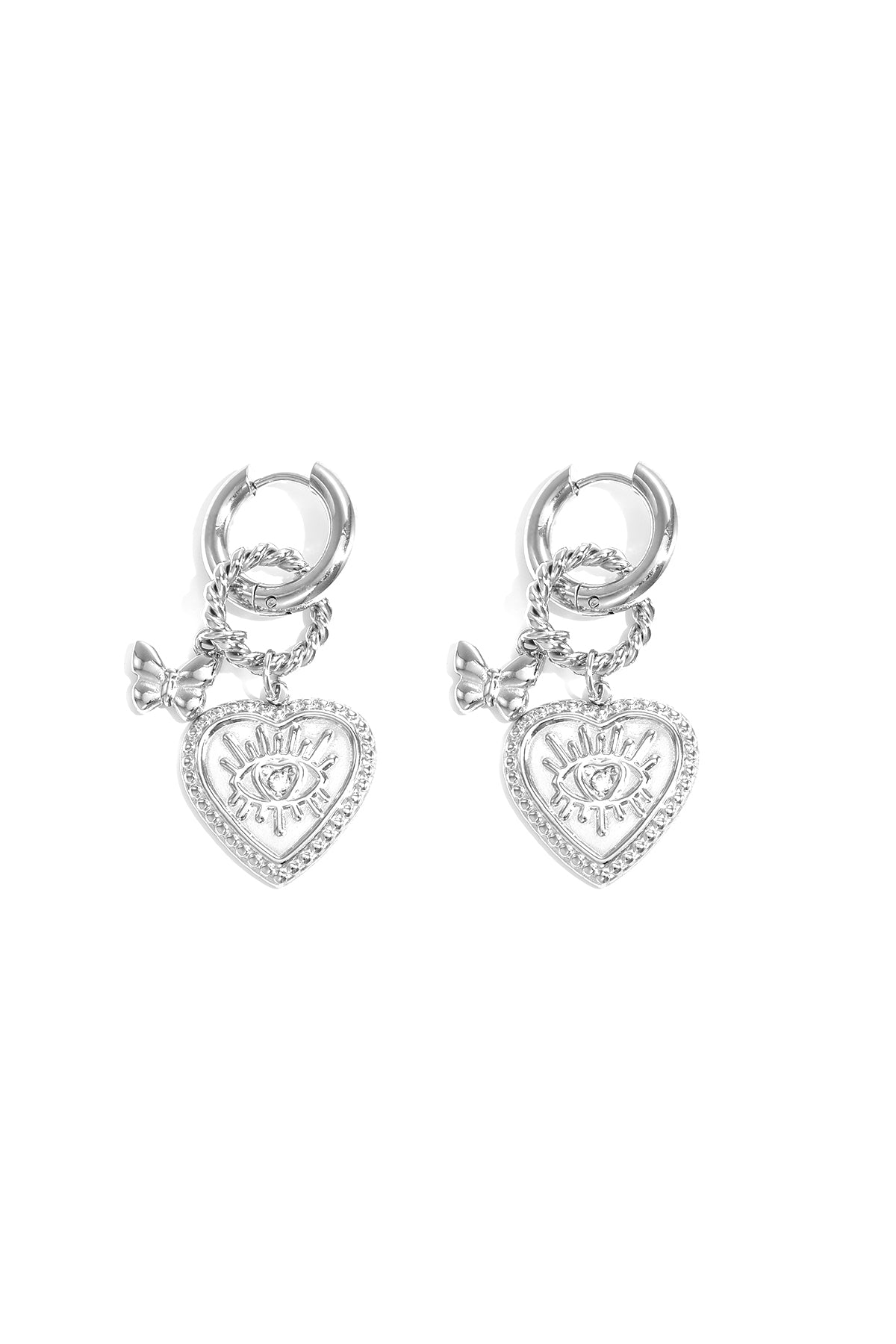 Silver heart charm hoop earrings with eye motif and butterfly detail on white background