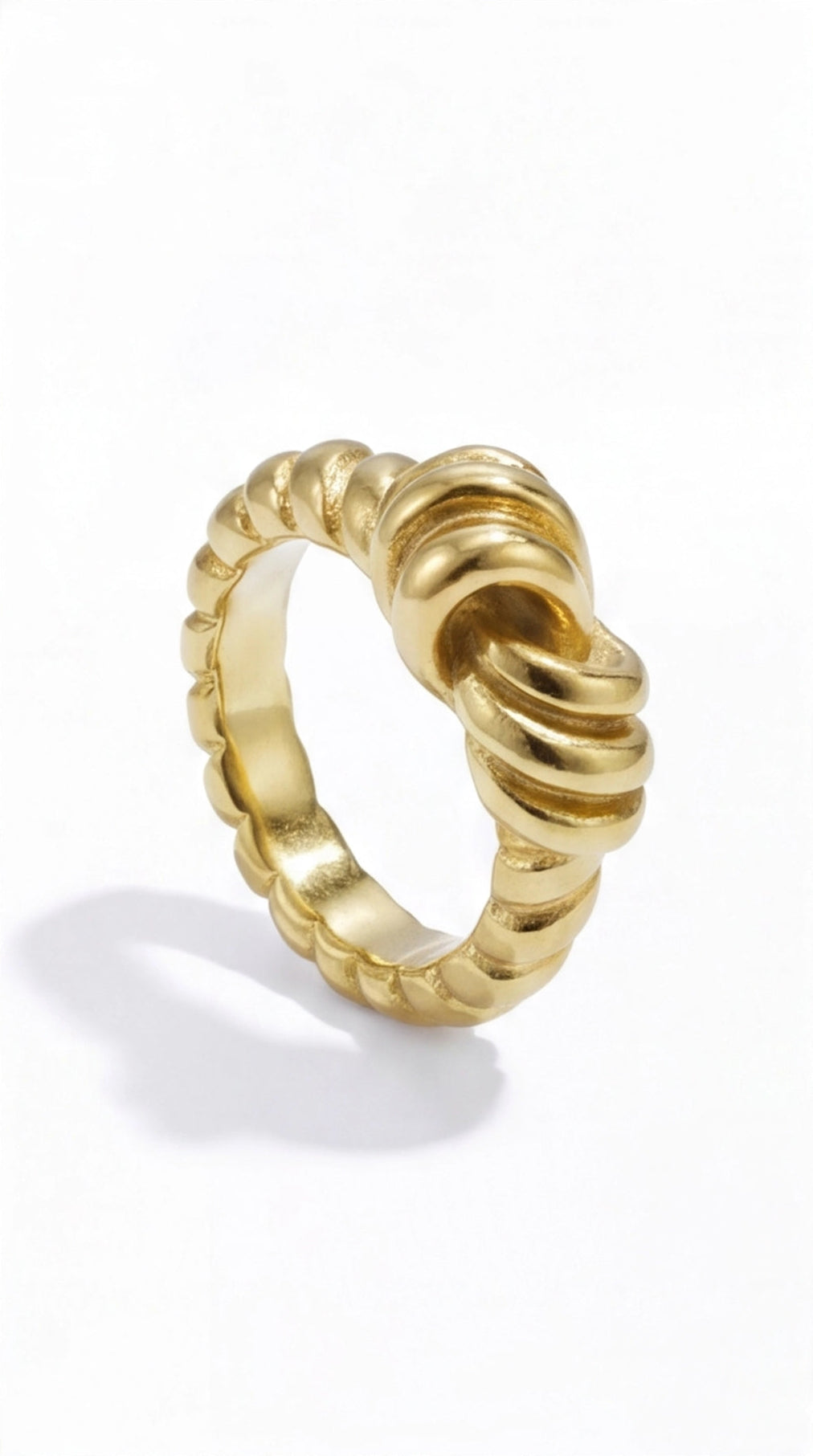 Gold Ribbon Knot Ring with a textured, twisted rope design in a polished, sculptural style on a white background.