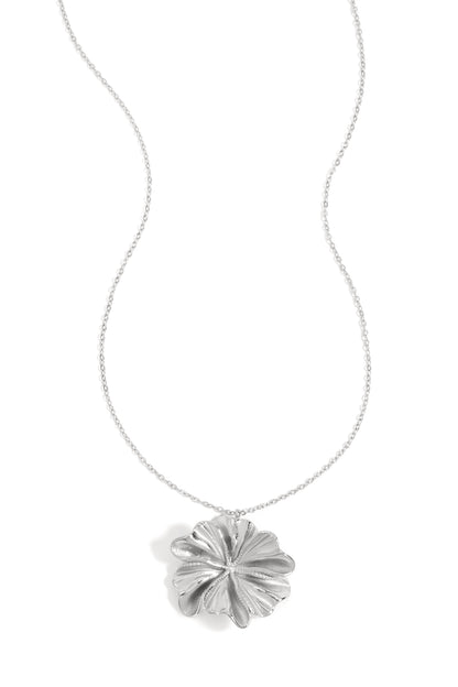 Silver flower-shaped pendant necklace with delicate chain on white background