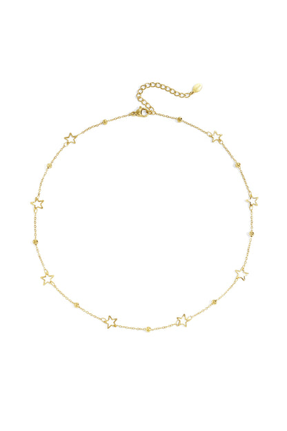 Delicate gold-tone star charm necklace with small bead accents and adjustable chain laid flat on white background