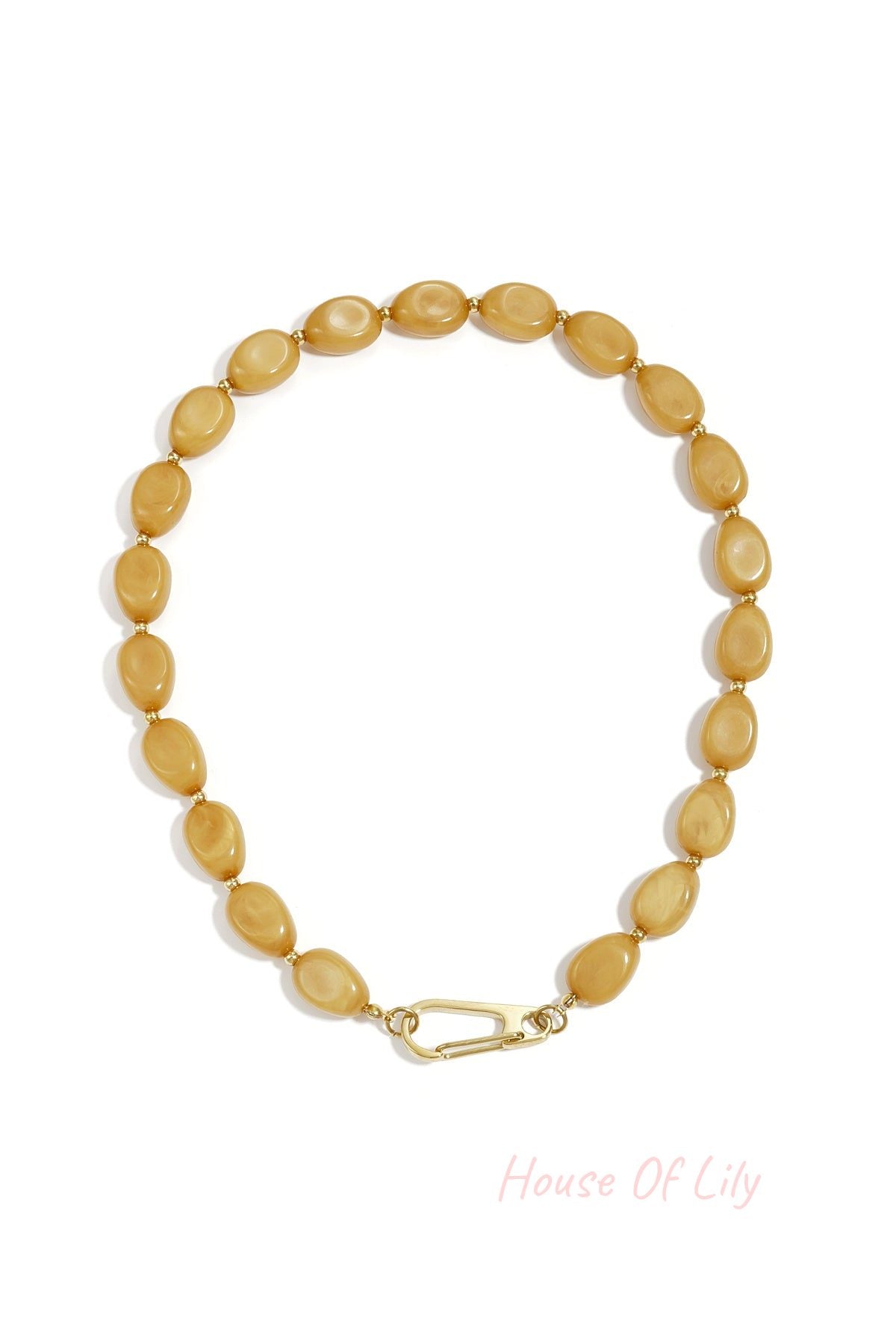 Mustard yellow acrylic beaded necklace with small gold beads and gold carabiner clasp shown on white background