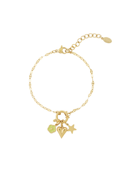 Gold chain bracelet worn with flower, heart, and star charms attached highlighting an adjustable lobster clasp closure