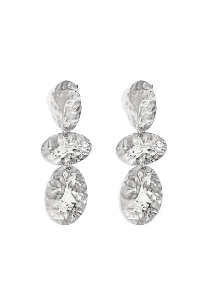 Pair of hammered silver oval dangle earrings with three connected textured oval shapes displayed on white background