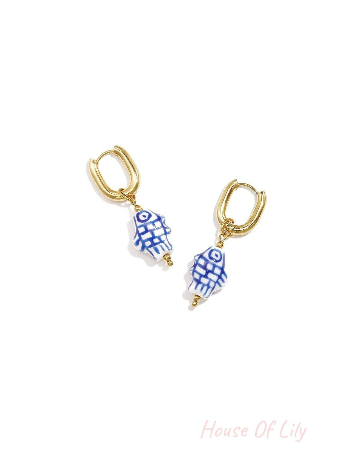 Squoval earrings with checkered fish charm