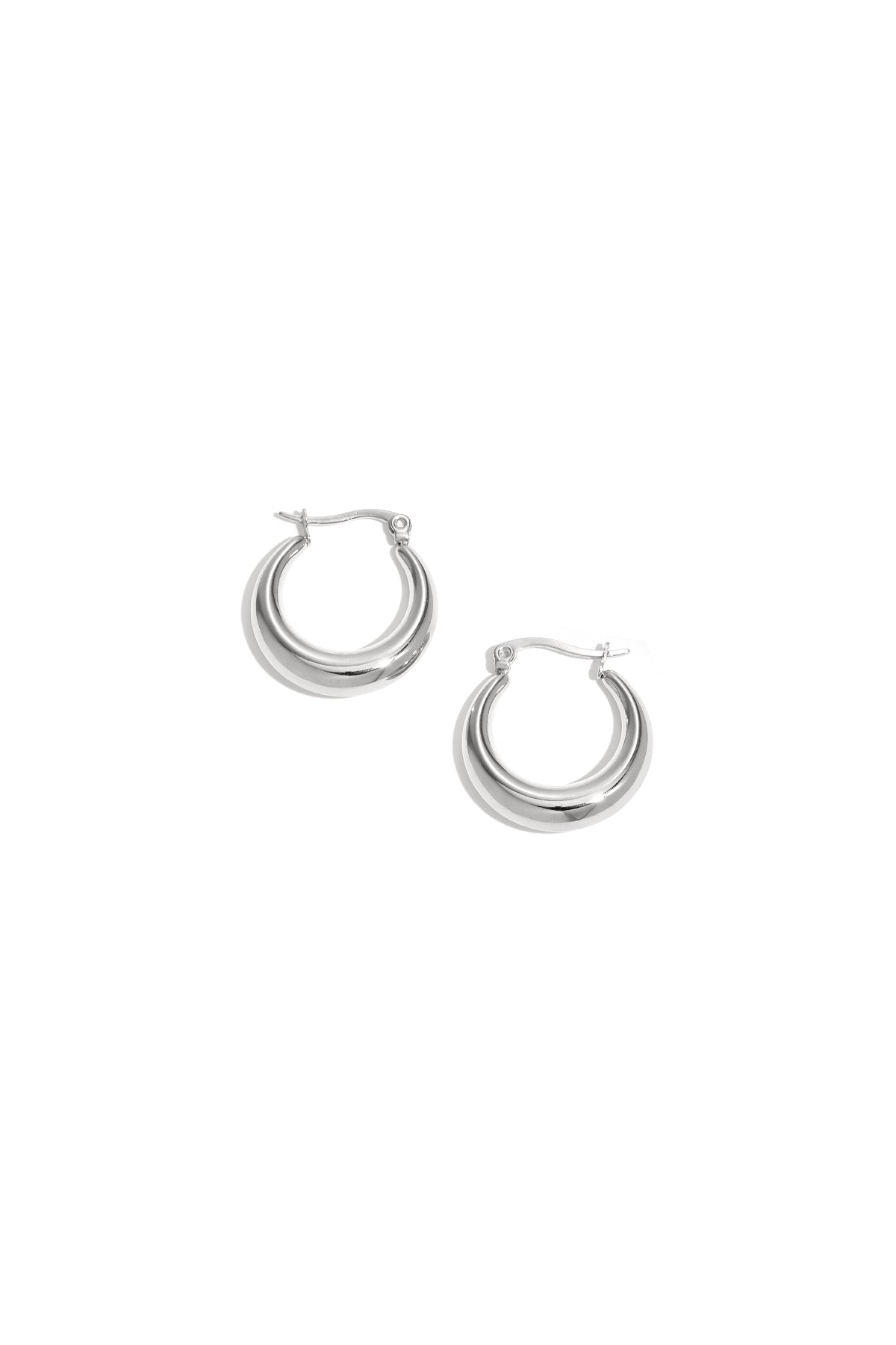 Pair of shiny chunky silver hoop earrings with a smooth polished finish displayed on a white background