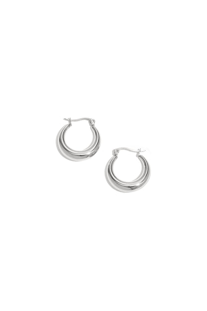 Pair of shiny chunky silver hoop earrings with a smooth polished finish displayed on a white background