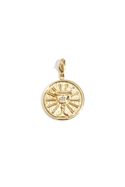 Gold circular pendant charm with a raised chalice design and rhinestone accents on a lobster clasp