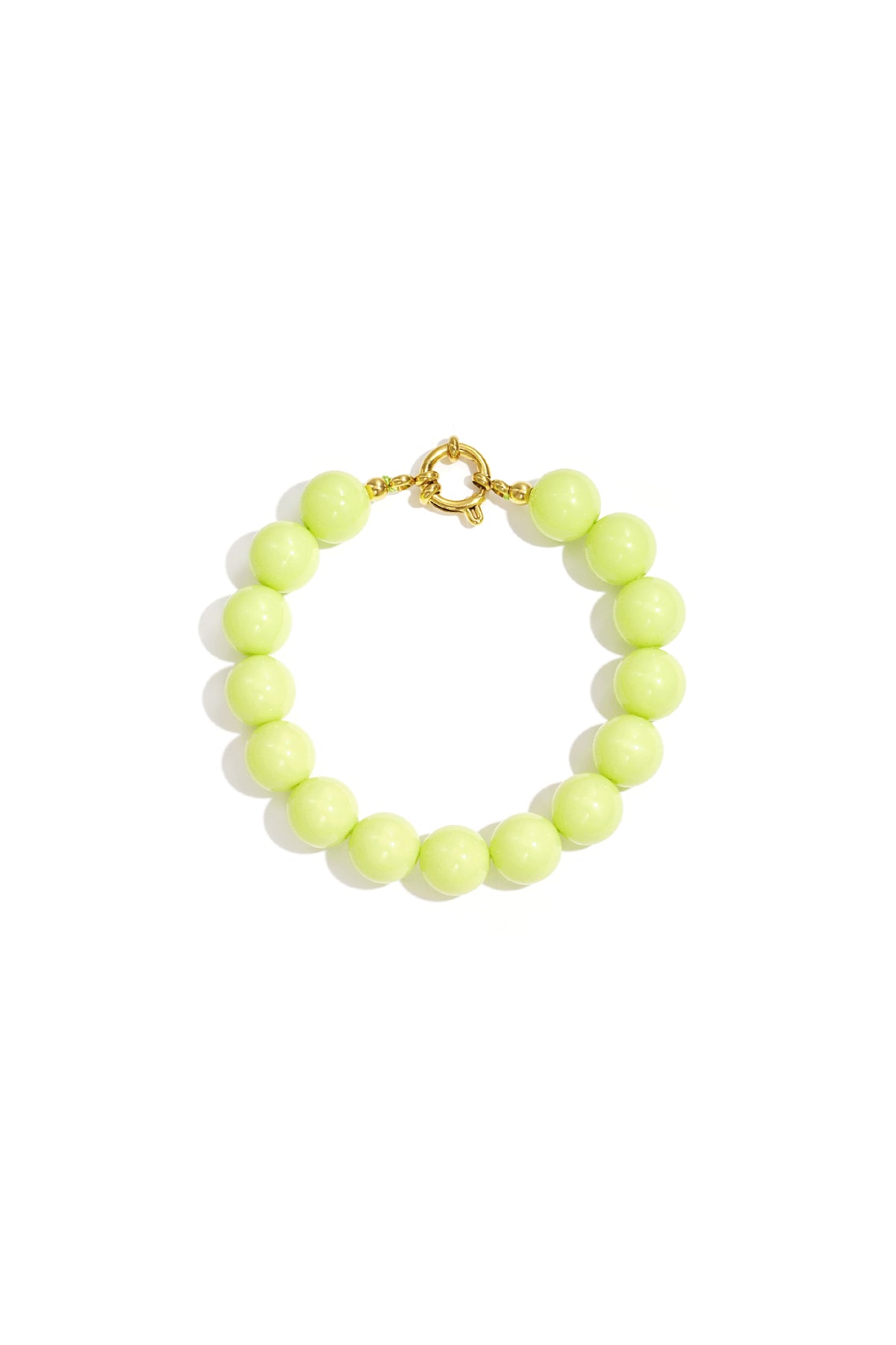 Light green resin bead bracelet with gold toggle clasp on white background