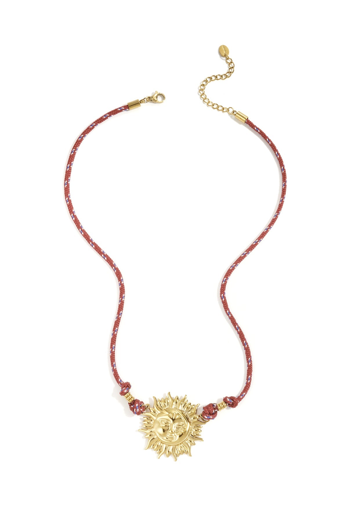 Gold-tone sun pendant necklace with red rope cord featuring blue and white accents laid flat